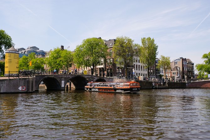 Amsterdam 1h Canal Cruise by Semi-Open Boat with Audio Guide - Heineken’s Oldest Brewery and Where Everyday History Shows Up