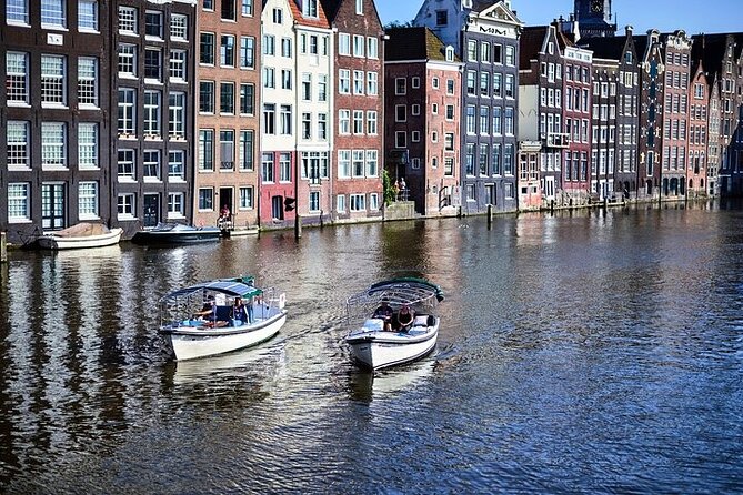 Amsterdam 2-hour Private Canal Cruise with Live Guide and Drinks - Amstel River: Amsterdam’s origin story, with old and new in the same frame