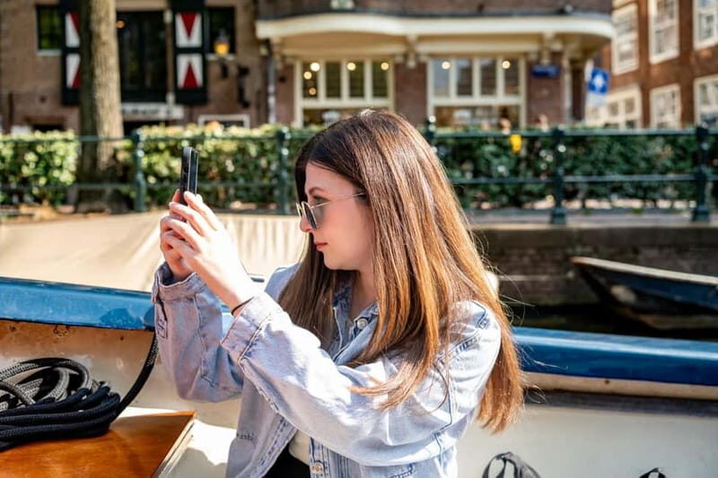 Amsterdam: 75 minute Open Boat Canal Cruise with Live Guide - The comfort reality check: what to bring for wind, sun, and rain