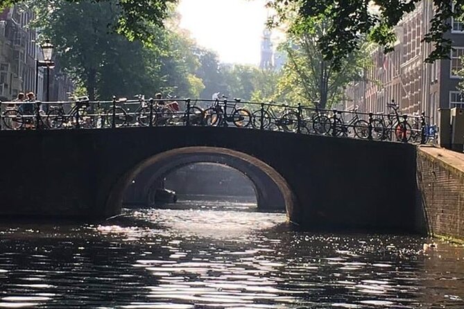 Amsterdam 90-min Private Canal Cruise with Live Guide and Drinks - Dancing Houses: the playful reminder Amsterdam isn’t all straight lines