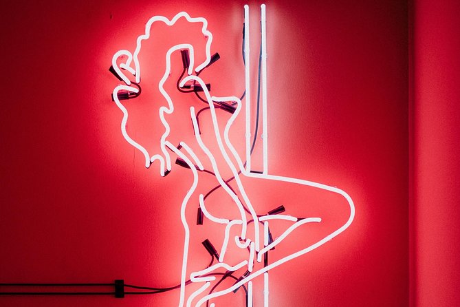 Amsterdam: Behind the Scenes Strip Club Tour with Ex-Sex Worker - Walking through the club: rooms, VIP areas, and the visual details
