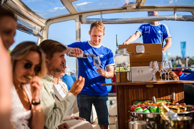 Amsterdam: Canal Booze Cruise with Unlimited Drinks Option - Skinny Bridge and the 7 Bridges Canal: The Landmarks That Make It Memorable