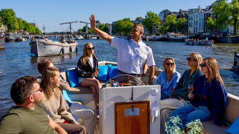 Amsterdam: Canal Cruise in Open Boat with Drink Option - Entering Amsterdam: Central Station vs. the Anne Frank House start