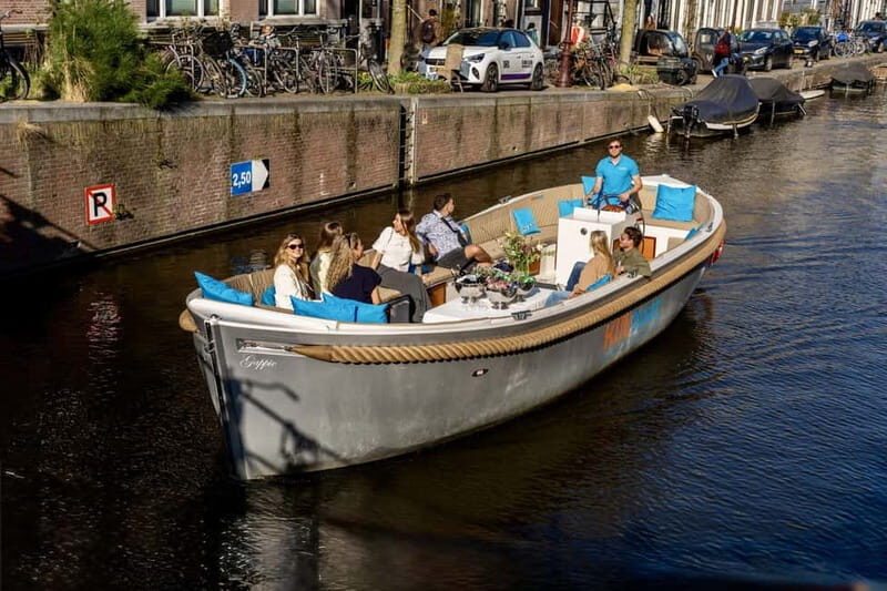 Amsterdam: Canal Cruise in Open Boat with Drink Option - The live guide stories: how the commentary makes the water make sense