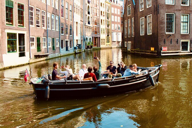Amsterdam Canal Tour by Open Boat – 90 min Small Group Experience - The route: Amstel River to the canal belt, with De Wallen in the mix