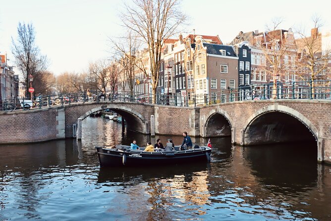 Amsterdam Canal Tour by Open Boat – 90 min Small Group Experience - Huis aan de Drie Grachten, Zuiderkerk, and the red-light edge from water