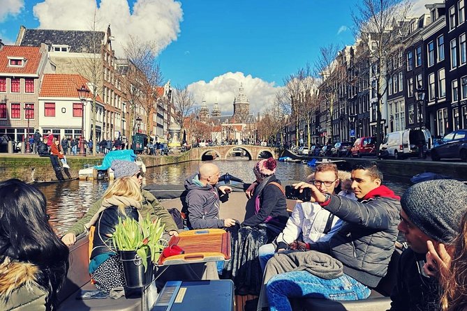 Amsterdam Canal Tour by Open Boat – 90 min Small Group Experience - Oudezijds Voorburgwal: old churches and layered neighborhood history
