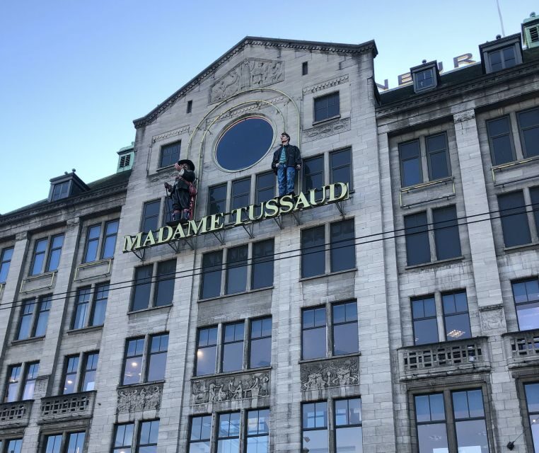 Amsterdam: City Center Walking Tour in italian - Dam Square, then quick Royal Palace and New Church photo pauses