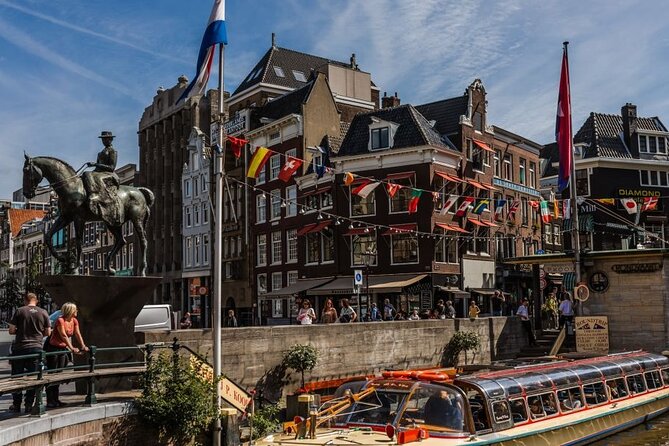 Amsterdam City Highlights and Hidden Gems - Private & Custom Tour - Market district energy: multicultural flavor and open-air stalls