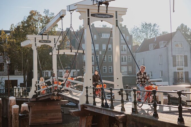 Amsterdam City Top Highlights Guided Bike Tour - Meeting on Nieuwezijds Voorburgwal: your first minute matters