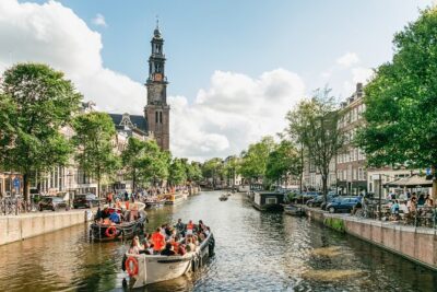 Amsterdam Classic Saloon Boat Canal Cruise with Live Guide - Your Live Guide Stops: Tilted Houses and the Marshland Cause