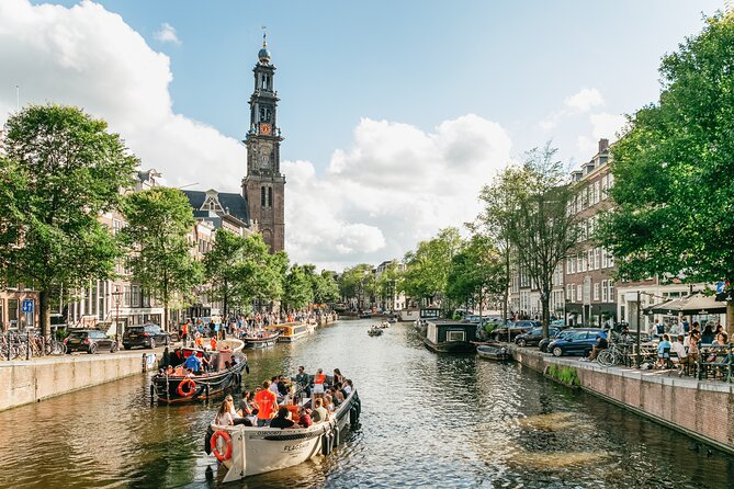 Amsterdam Classic Saloon Boat Canal Cruise with Live Guide - Your Live Guide Stops: Tilted Houses and the Marshland Cause