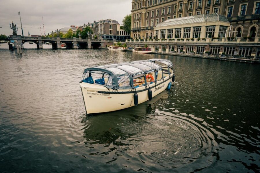 Amsterdam: Covered Canal Booze Cruise with Unlimited Drinks - A 1-hour boozy canal cruise that feels like Amsterdam, not a ride
