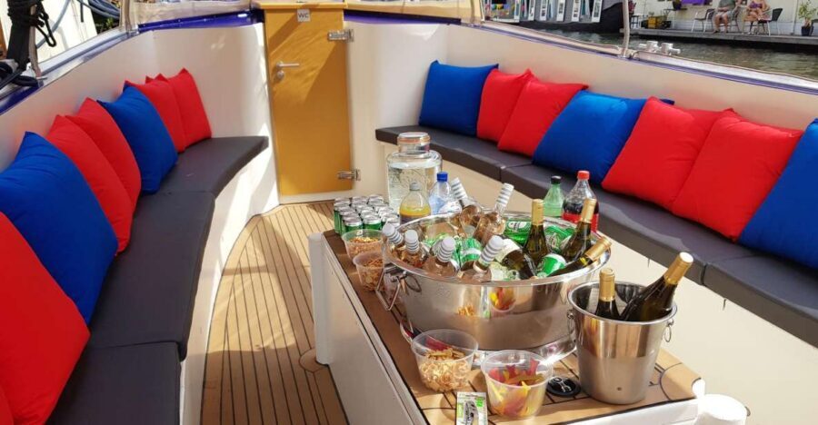 Amsterdam: Covered Canal Booze Cruise with Unlimited Drinks - Covered boat comfort: how blankets and shade change your experience
