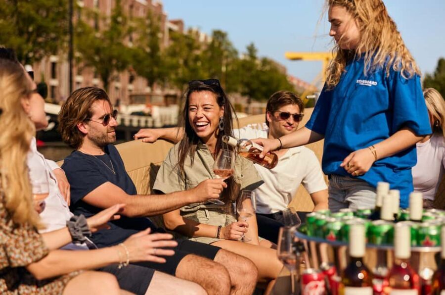 Amsterdam: Cozy Evening Canal Cruise With Open Bar Option - Where You Meet: Oudezijds Voorburgwal 230 and the Blue Starboard Look