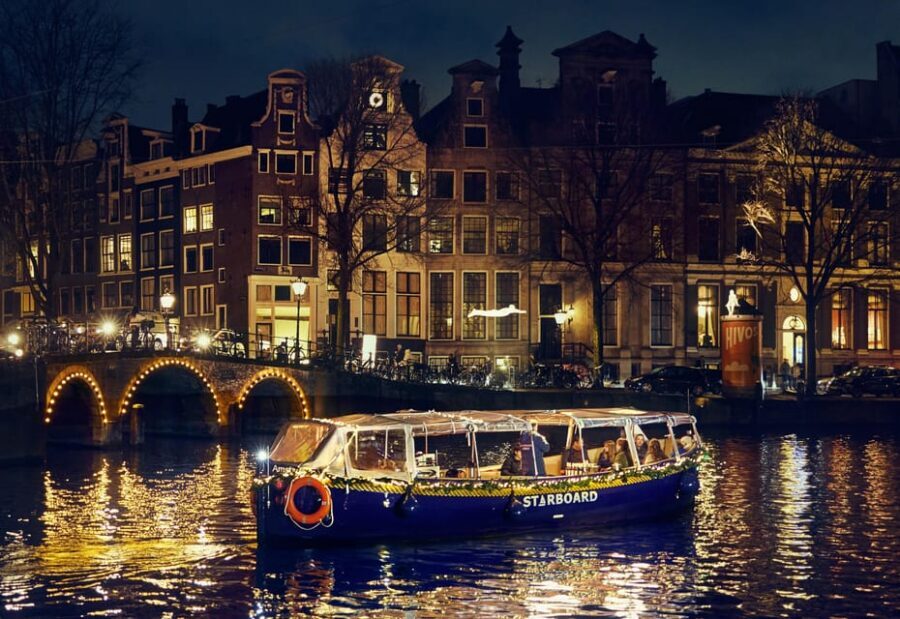 Amsterdam: Cozy Evening Canal Cruise With Open Bar Option - The Margere Brug Bridge Moment and the Amstel Beer Story