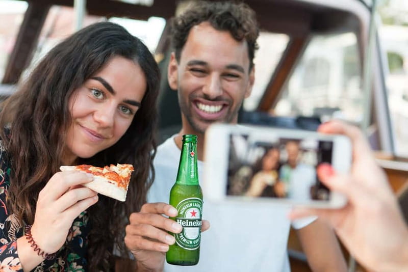 Amsterdam: Evening Pizza Cruise Along the Canals - What the captain and host say, and how to catch it