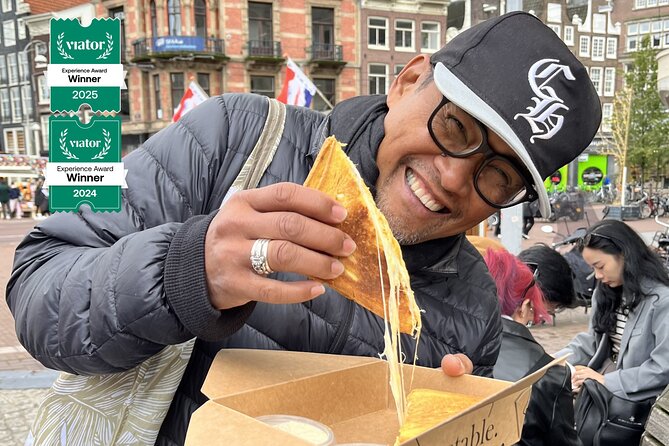 Amsterdam Food and Cultural Tour with Tastings - Torensluis crooked houses and the monarchy story