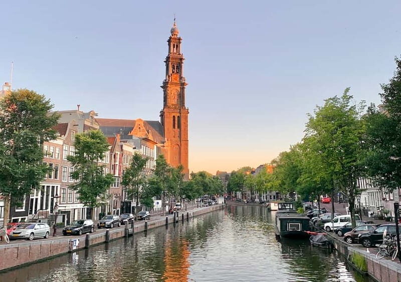 Amsterdam: German Canal Cruise with Unlimited Drinks Option - One Hour on an Open Canal Boat (Quiet, Cozy, and Built for Photos)