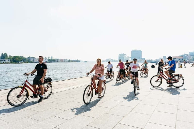 Amsterdam: Guided Bike Tour City Centre in EN/DE/FR/ES - Western Islands: drawbridges, old warehouses, and art-studio vibes