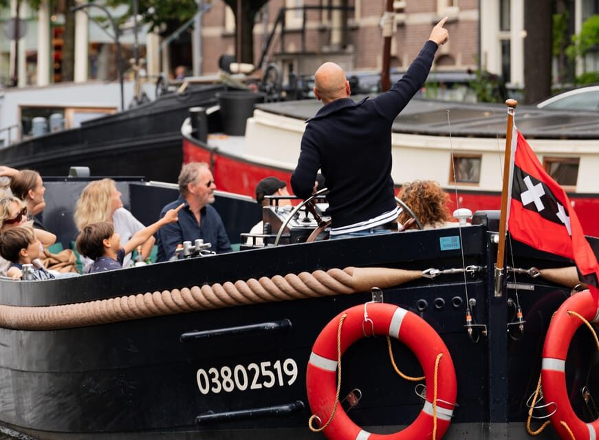 Amsterdam: Guided Open Boat Canal Cruise Including Drink - The guided canal route: stop-by-stop photo moments that actually matter