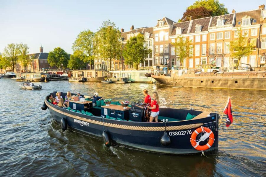 Amsterdam: Guided Open Boat Canal Cruise Including Drink - The Amstel angle: Carré and bridge views that make the hour feel longer