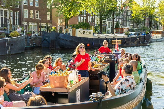 Amsterdam: Guided Open Boat Canal Cruise Unlimited Drinks Option - Open-boat comfort: electric quiet, blankets, and weather gear