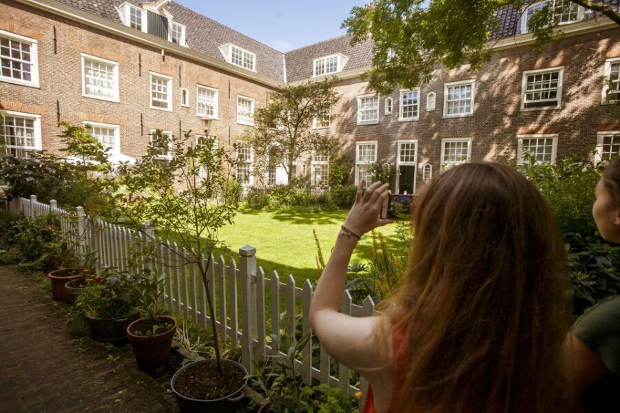 Amsterdam: Hidden Gems & Highlights Guided Bike Tour - Jordaan district: canal-ring vibes plus courtyards and churches