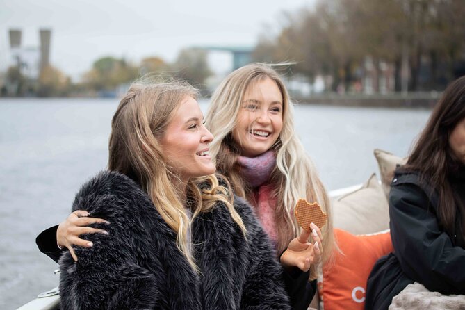 Amsterdam: Luxury Saloon Boat Cruise with Cocktails & Waffle - The crew makes it: captain storytelling plus a host