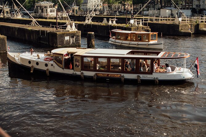 Amsterdam: Luxury Saloon Boat Cruise with Cocktails & Waffle - Getting to the dock: Oudezijds Voorburgwal and the NH Krasnapolsky area
