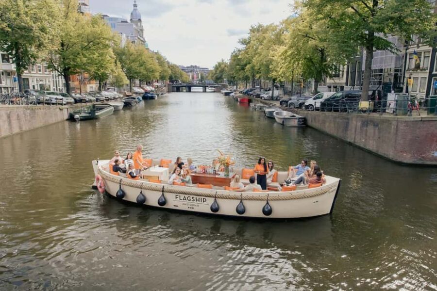 Amsterdam: Open Boat Cruise option Unlimited Drinks & Bite - Skinny Bridge to the Hermitage: the landmark set that makes the hour fly