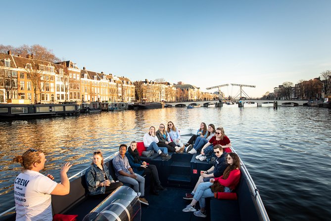 Amsterdam Open Boat Cruise with Live Guide and Two Drinks - Open-Air Comfort: Heated Seats, Umbrellas, and Covered Alternatives