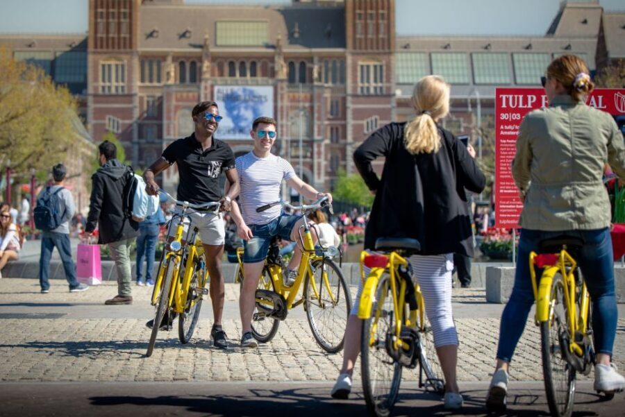 Amsterdam: Relaxed City Highlights Guided Bike Tour - Canal-belt classics: grachtengordel streets, tiny houses, and that old prison story