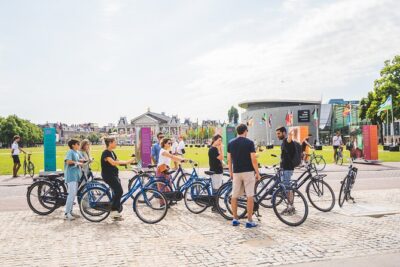 Amsterdam Small-Group Bike Tour With Optional Canal Cruise - Meet at Nieuwezijds Voorburgwal: start strong and avoid the chaos