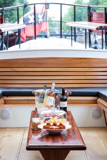 Amsterdam: Small-Group Canal Cruise incl. Drinks and Snacks - Red light district views plus everyday neighborhoods