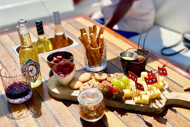 Amsterdam Small-Group Canal Cruise Including Snacks and Drinks - Via the Amstel toward the Red Light District area