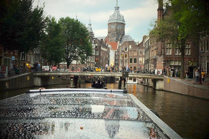 Amsterdam Small-Group Canal Cruise Including Snacks and Drinks - National Maritime Museum area and the Golden Age ship view