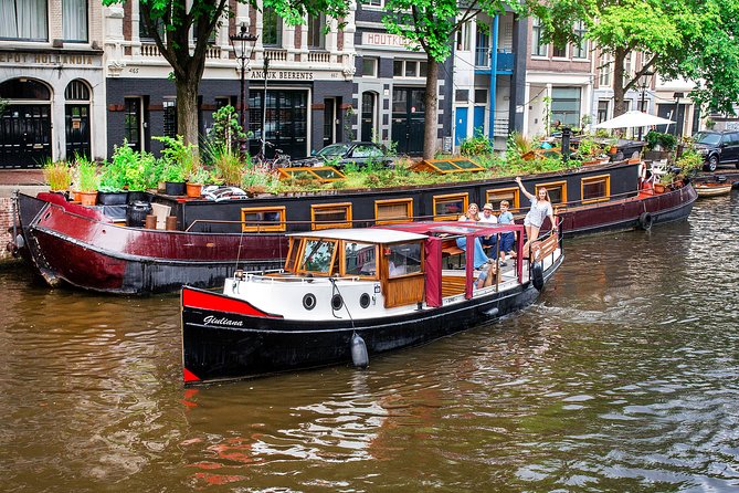 Amsterdam Small-Group Canal Cruise With Dutch Snacks and Drink - From maritime museums to kids’ science stops: a cruise that fits different interests