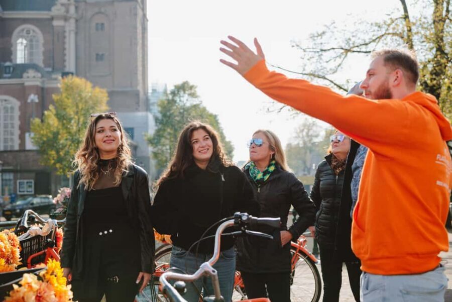 Amsterdam: Top Highlights Guided Bike Tour EN/DE/ES/FR/IT/CN - Where you meet near Central Station and what the ride feels like