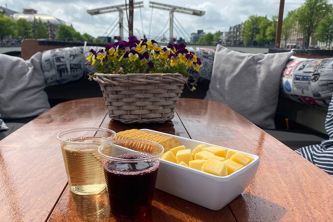 Dutch Cheese & Drinks Guided Amsterdam Boat Tour, All Inclusive - On board: an electric boat with a drinks-and-cheese rhythm
