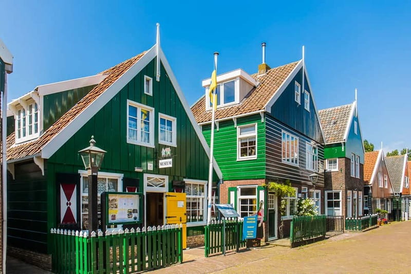 From Amsterdam: Zaanse Schans, Volendam, and Marken Day Trip - The coach ride: live commentary plus audio for the whole group