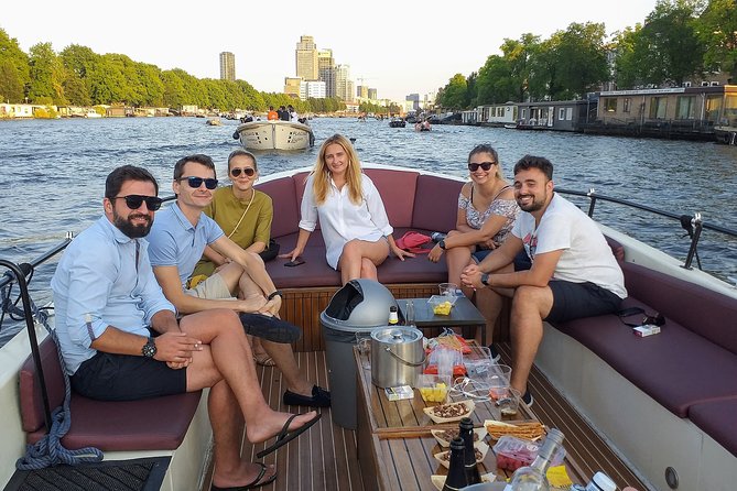 Guided Amsterdam Canal Cruise – Snacks & Drinks on board(1 Hour) - One-hour Amsterdam canal time that actually fits your day