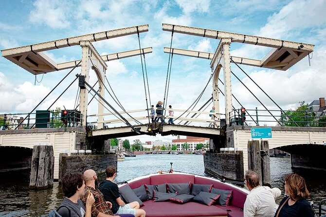 Guided Amsterdam Canal Cruise – Snacks & Drinks on board(1 Hour) - Modern Amsterdam on the water: the ship-shaped futuristic building and rooftop views
