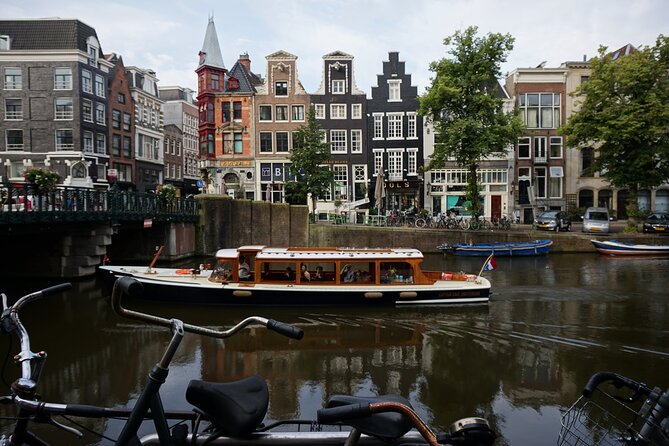 Morning Canal Cruise Amsterdam in Small-Group - The Boat: A 1928 Saloon Ride That Stays Dry