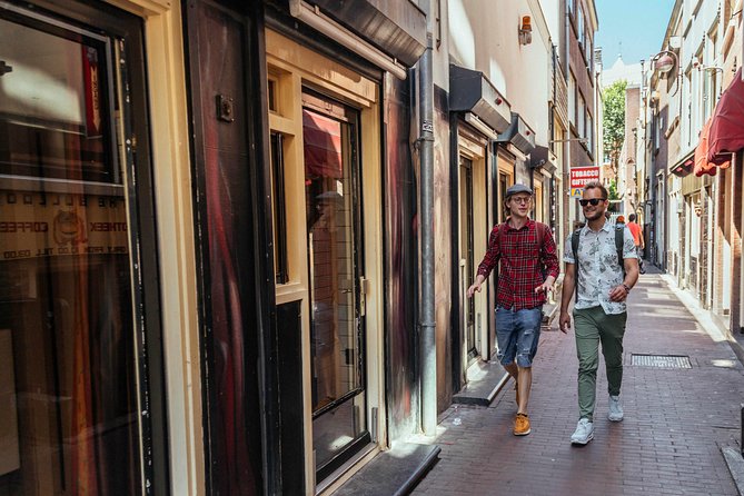 Private City Kickstart Tour: Amsterdam - Bloemenmarkt and Begijnhof: Market Smells to Medieval Quiet