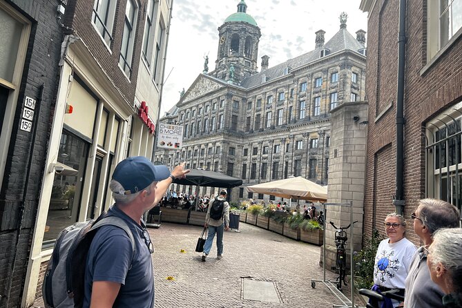 Small Group Walking Tour in Amsterdam with Friendly and Fun Guide - Dam Square and Damstraat: how Amsterdam grew from water to power