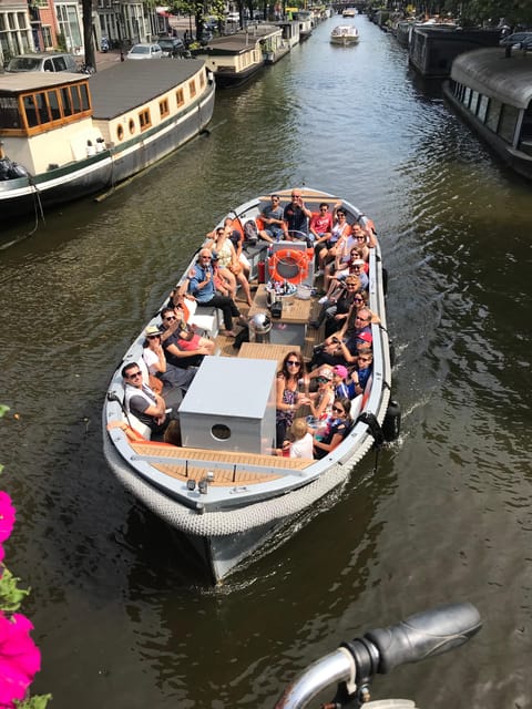 Visit Amsterdam by Boat with a French Guide (french) - Why this small electric canal cruise feels different than the big-boat version